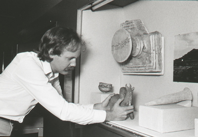 Exhibition designer (and currently our venerable head of the Museum Services Division) Michael McCafferty installs rhyton in a case, 1983, Photo: Paul Macapia
