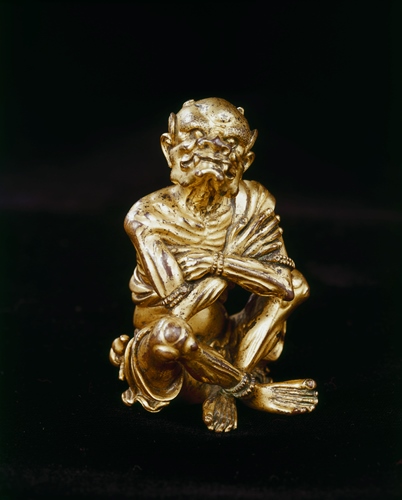 Seated demon figure, 14th century, Chinese, bronze with gilt, 3 1/4 x 2 x 1 7/8 in., Eugene Fuller Memorial Collection, 52.45. Currently on view at the Asian Art Museum.