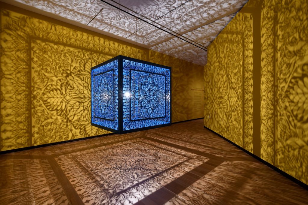 A Beautiful Despair (Blue), 2021, Anila Quayyum Agha, Pakistani-American, b. 1965, lacquered steel and halogen bulb, 60 x 60 x 60 inches, Courtesy of Sundaram Tagore Gallery, NYC, the artist, © Anila Quayyum Agha, photo: Steve Watson/Amon Carter Museum of American Art, Fort Worth, TX.